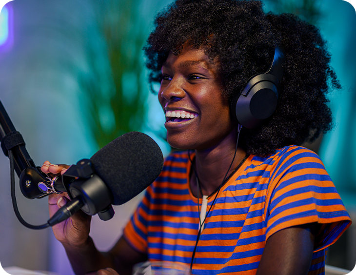 Podcaster speaking into a studio microphone